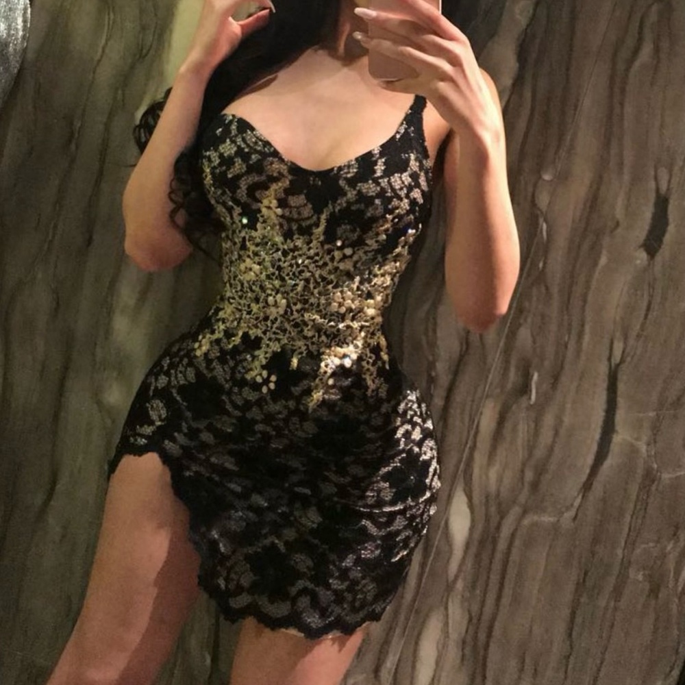 Holt miami black and gold dress.
